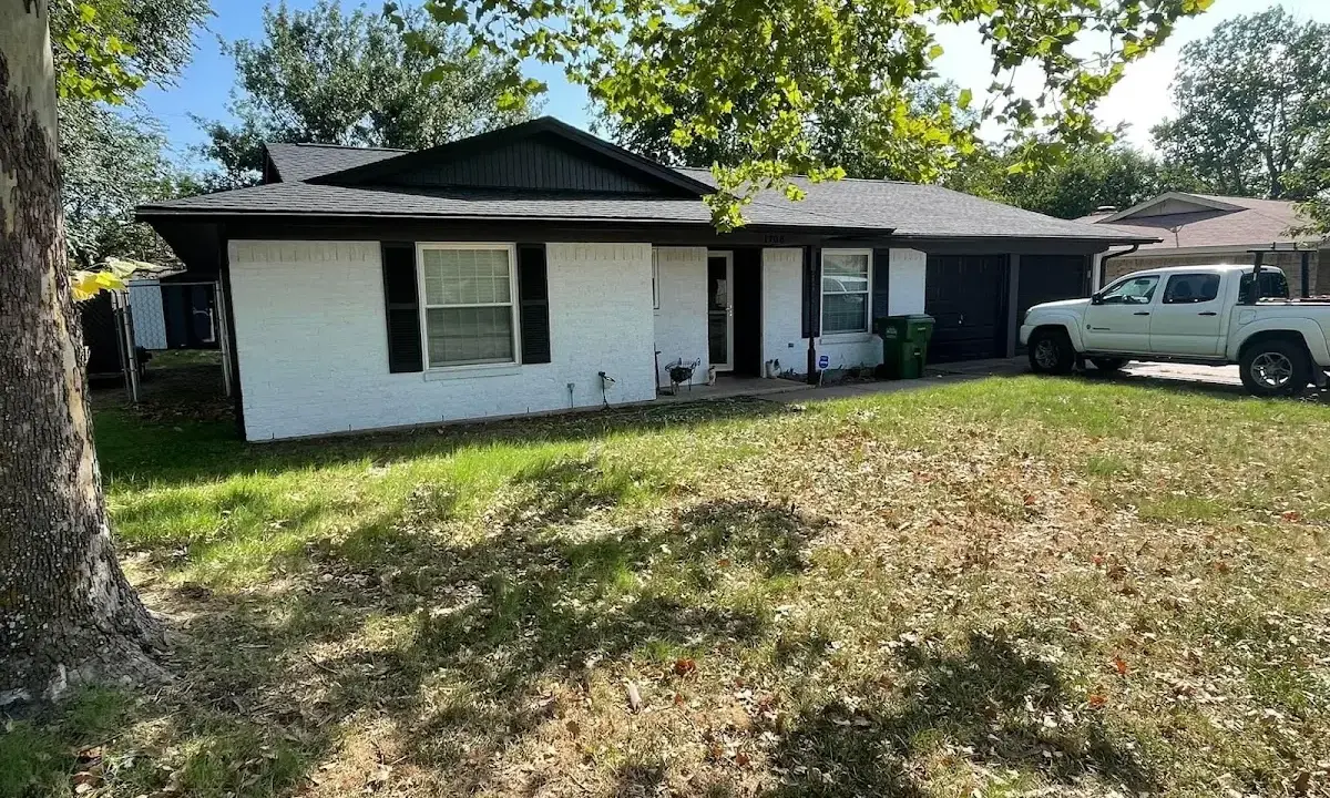 Professional roofing crew working on a residential roof in Skiatook